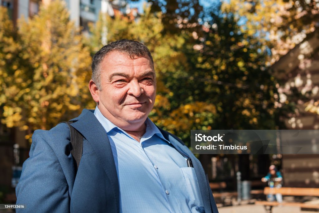 Portrait of an cheerful obese senior man, well-dressed for an celebration event Portrait of an senior obese man, well-dressed for an celebration event Obesity Stock Photo