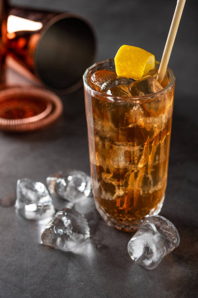istock Luxury cocktail and cocktail shaker on black stone background 1349135012