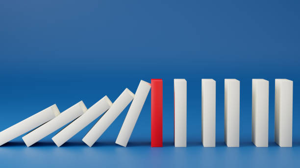 white domino effect stopped by red domino. business crisis effect or risk protection, business solution and intervention, leadership, Strategy development. 3D Render Illustration. white domino effect stopped by red domino. business crisis effect or risk protection, business solution and intervention, leadership, Strategy development. 3D Render Illustration. recession protection stock pictures, royalty-free photos & images