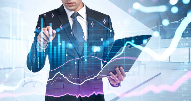 istock Businessman wearing formal suit is holding clipboard and touchin 1349138048
