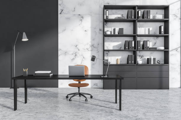 istock Close view on office room interior with laptop, comfortable armchair 1349138305