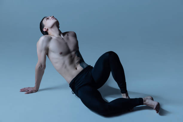 istock One handsome man, male ballet dancer in art performance isolated on old navy studio background. Art, motion, action, flexibility, inspiration concept. 1349138401