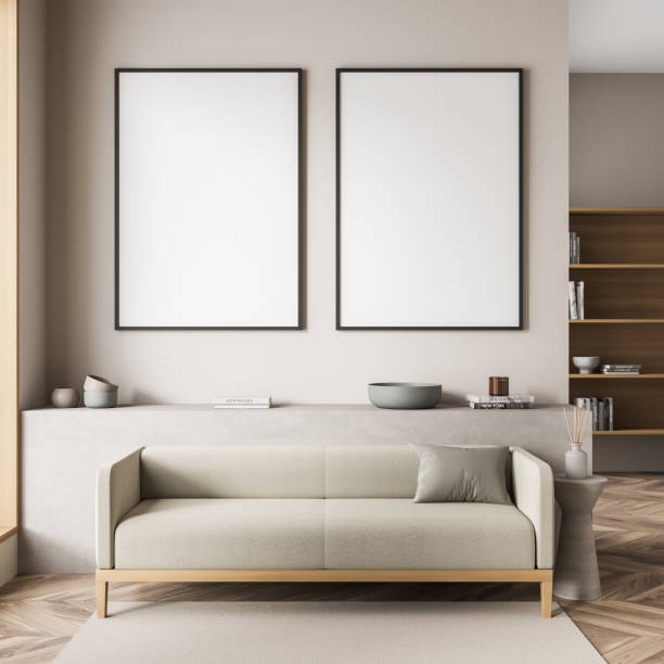 istock Two empty framed canvases on beige wall of small living room 1349138512