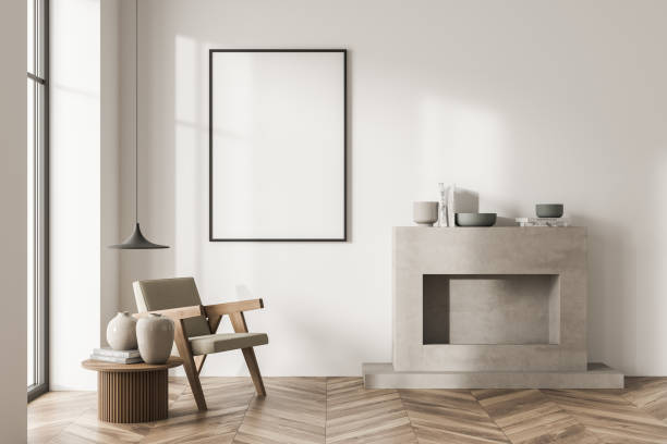 istock Empty canvas on beige living room wall with single armchair 1349139603