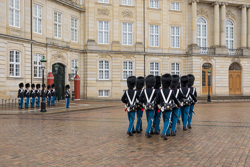 May 23 2022 - Copenhagen, Denmark: Guards marching outside royal palace at Amalienborg