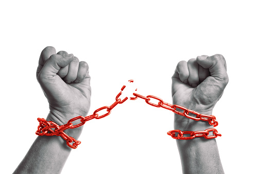 Man breaks the chains and gains freedom. Concept of gaining freedom.