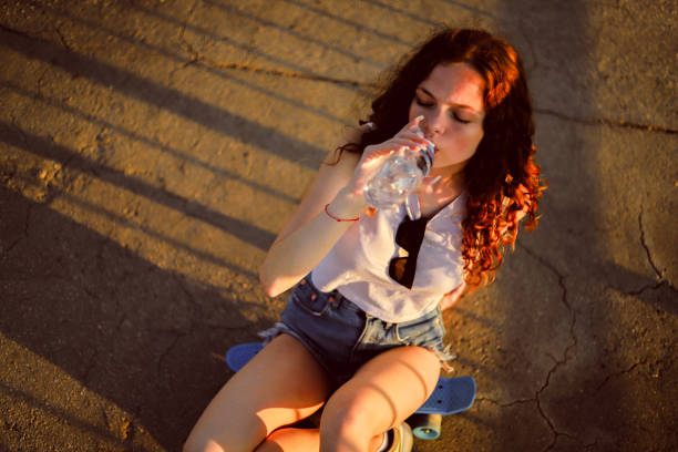 Girl sitting on the skateboard