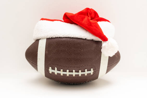istock Rugby ball and red cap isolated on white background 1349142459