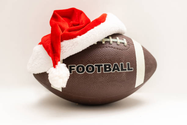 istock Rugby ball and red cap isolated on white background 1349142579