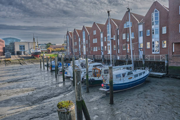 istock Husum harbor at ebb tide in the marshes, Germany 1349143269