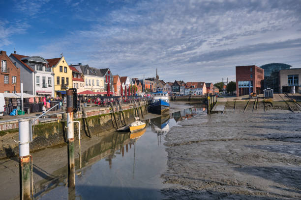 istock Husum harbor at ebb tide in the marshes, Germany 1349143331