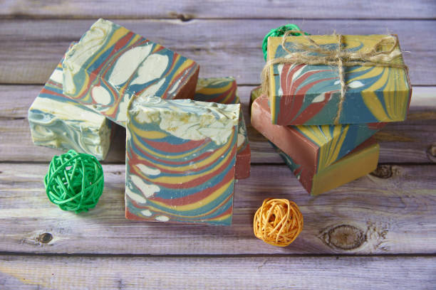istock Several pieces of multicolored handmade organic soap and various decorations . 1349143431