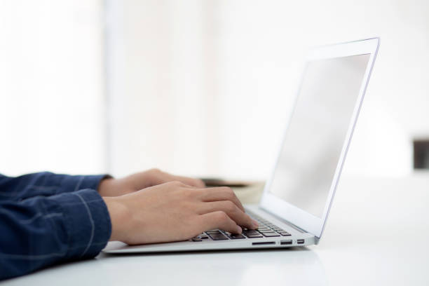 istock Hand of business man working from home using laptop computer to internet online on desk, lifestyle of new normal, social distancing, freelance work in stay home, employee using notebook indoor. 1349143719