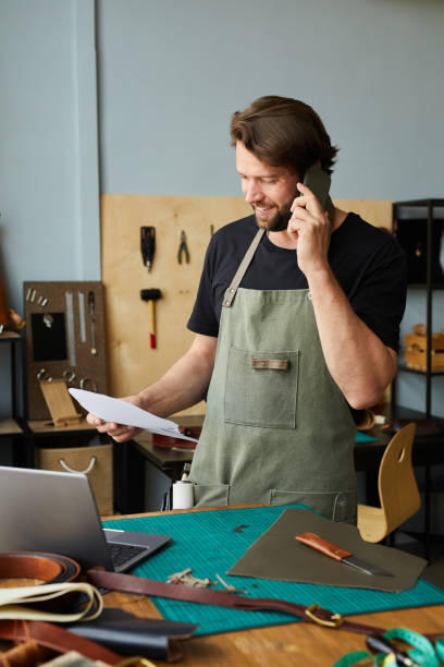 istock Smiling Craftsman Managing Small Business 1349150797