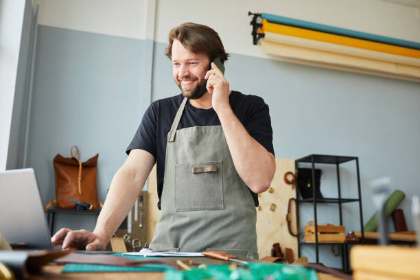 istock Smiling Man Managing Small Business 1349150802