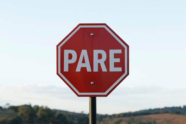 mandatory stop sign, in Portuguese PARE stock photo