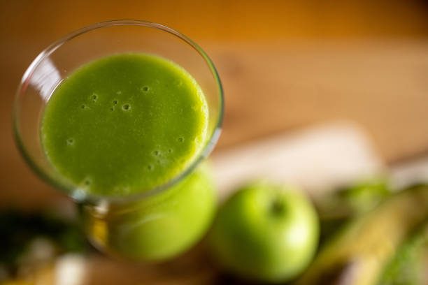 Fresh detox drink from organic fruit on table