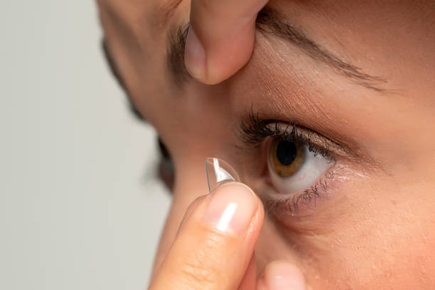 istock woman wearing contact lens 1349156071