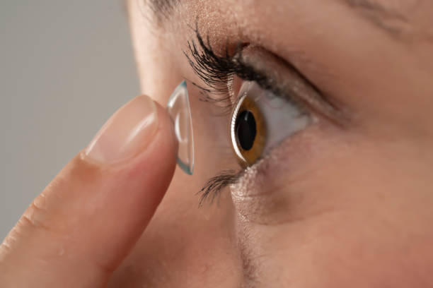 istock young woman wearing contact lens 1349156085