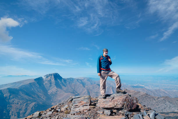 Elderly climber is happy and proud of herself after a hard climbing activity.