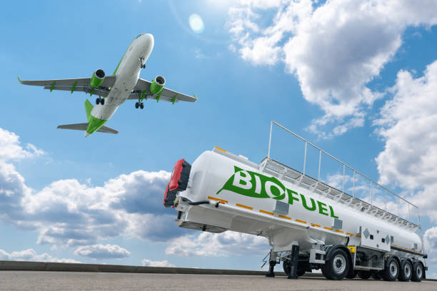 Airplane and biofuel tank trailer stock photo
