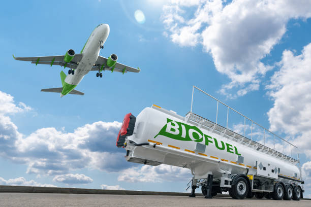 Airplane and biofuel tank trailer Airplane and biofuel tank trailer. Decarbonization concept fossil fuel stock pictures, royalty-free photos & images