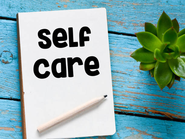 istock SELF CARE words written in an office notese. 1349162944