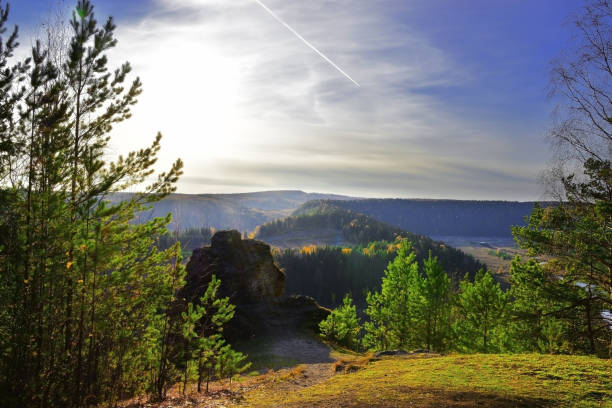 Sunset over Vakutin Kamen and the river valley of the Irgina River on an October autumn day