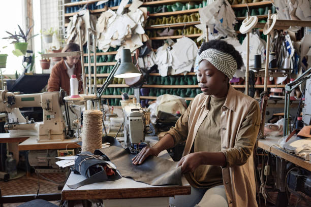 istock Woman sewing product in workshop 1349164030