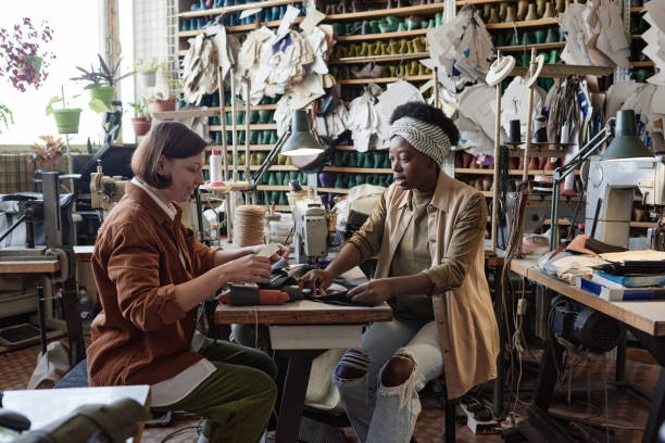 istock Tailors working together in the clothes factory 1349164083