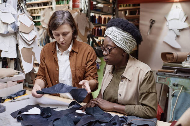 istock Tailors working with pieces of fabric 1349164381