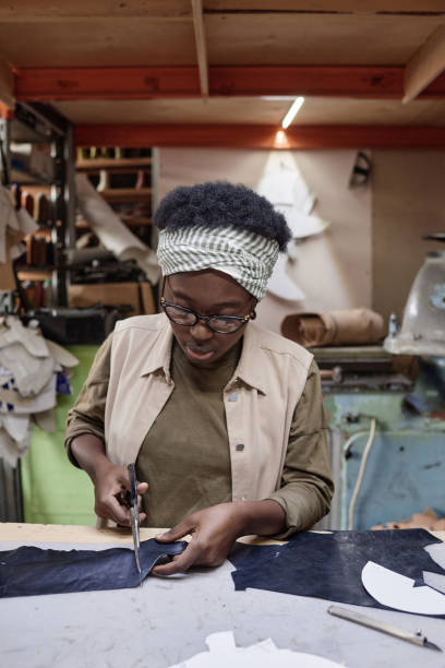istock Tailor cutting the fabric in the workshop 1349164423