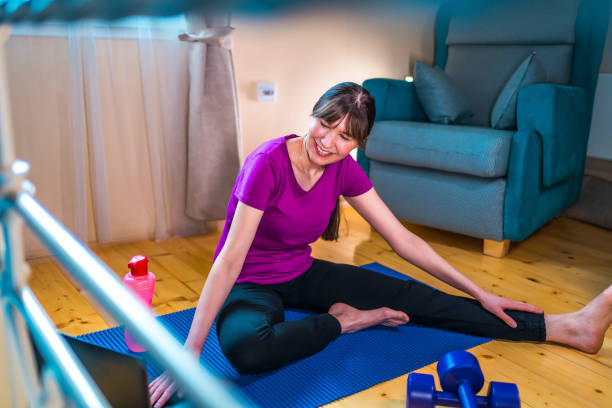 istock Woman working out with laptop at home 1349165640