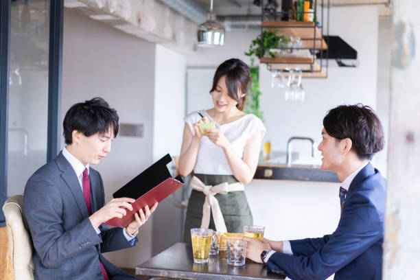 istock Female restaurant staff confirming an order 1349165712