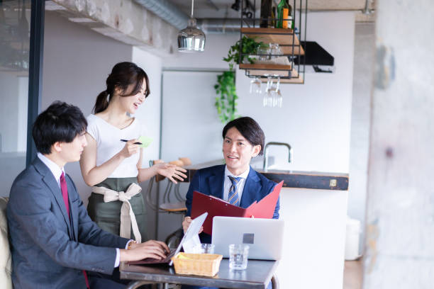 istock Female restaurant staff confirming an order 1349165723