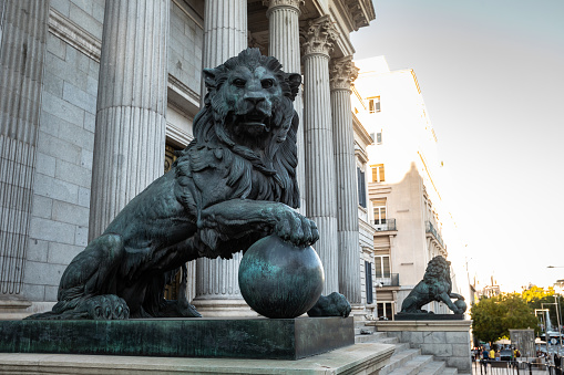 Spanish parliament (Congreso de los diputados) famous facade with two lions sculptures at each side; Madrid, Spain.