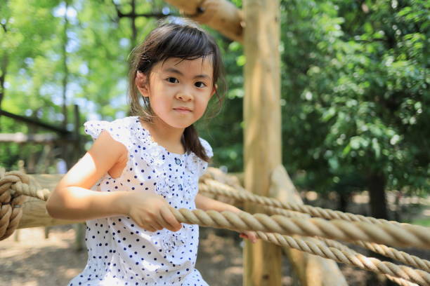 istock Japanese student girl playing with rope walking (6 years old) 1349175460