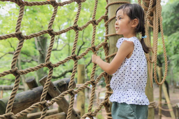 istock Japanese student girl playing with rope walking (6 years old) 1349175519