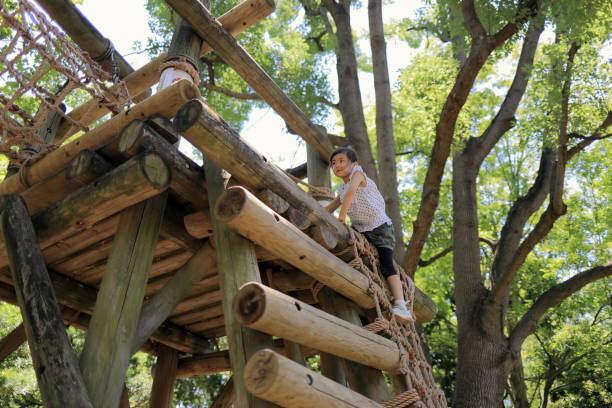 istock Japanese student girl playing at outdoor obstacle course (6 years old) 1349176959