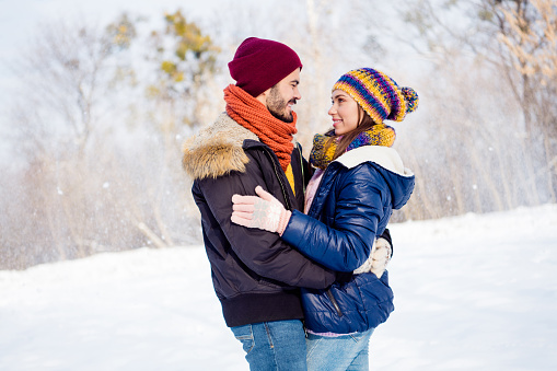 Portrait of attractive positive lady handsome guy hugging look gentle each other have good mood weekend outdoors