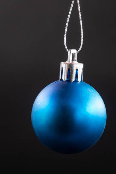 istock blue christmas ball isolated on black background 1349177305