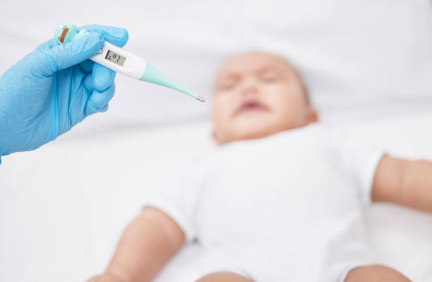 istock .Shot of a unrecognizable doctor taking a babys temperature 1349179269