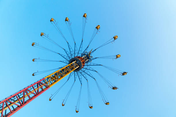 The rotating flying chair is in the amusement park