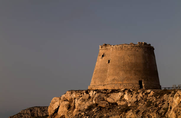 istock Castle-like building on coast against blue clear sky 1349180344