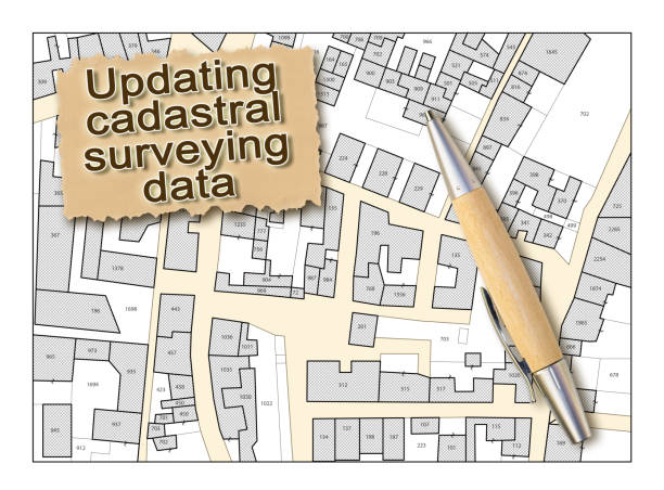 istock Updating public cadastral digital databases and information about land registry - concept with an imaginary cadastral map of territory with buildings and land parcel 1349182433