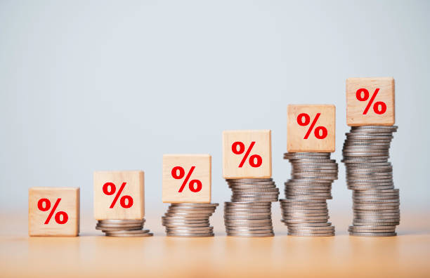 istock Percentage sign print screen on wooden cube block which lay down on increasing coins stacking for interest rate and business profit growth concept. 1349186326