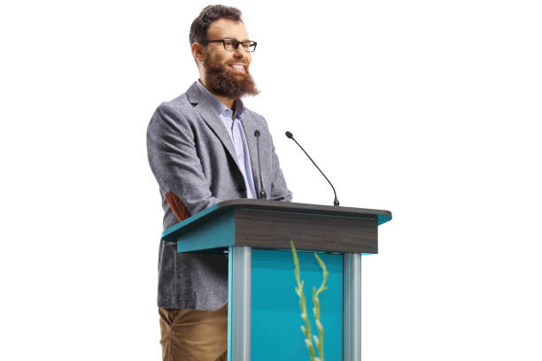 istock Bearded man on a podium giving a speech and smiling 1349187274