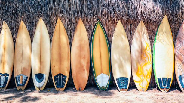Surfboard ready to use in Thailand Surfboard on the wall breaking wave stock pictures, royalty-free photos & images