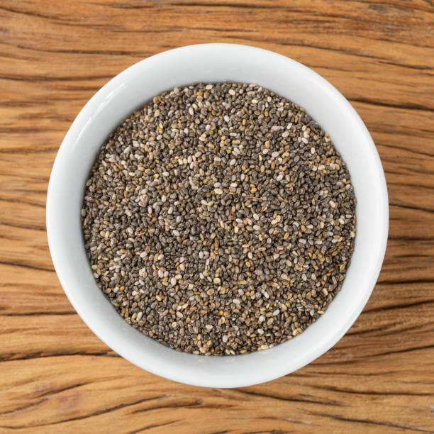 istock Chia seeds in a white bowl over wooden table 1349189800