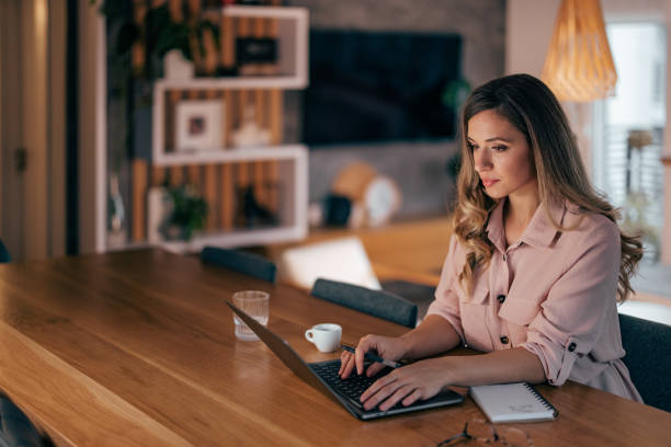 istock Woman working on laptop at home. 1349189946